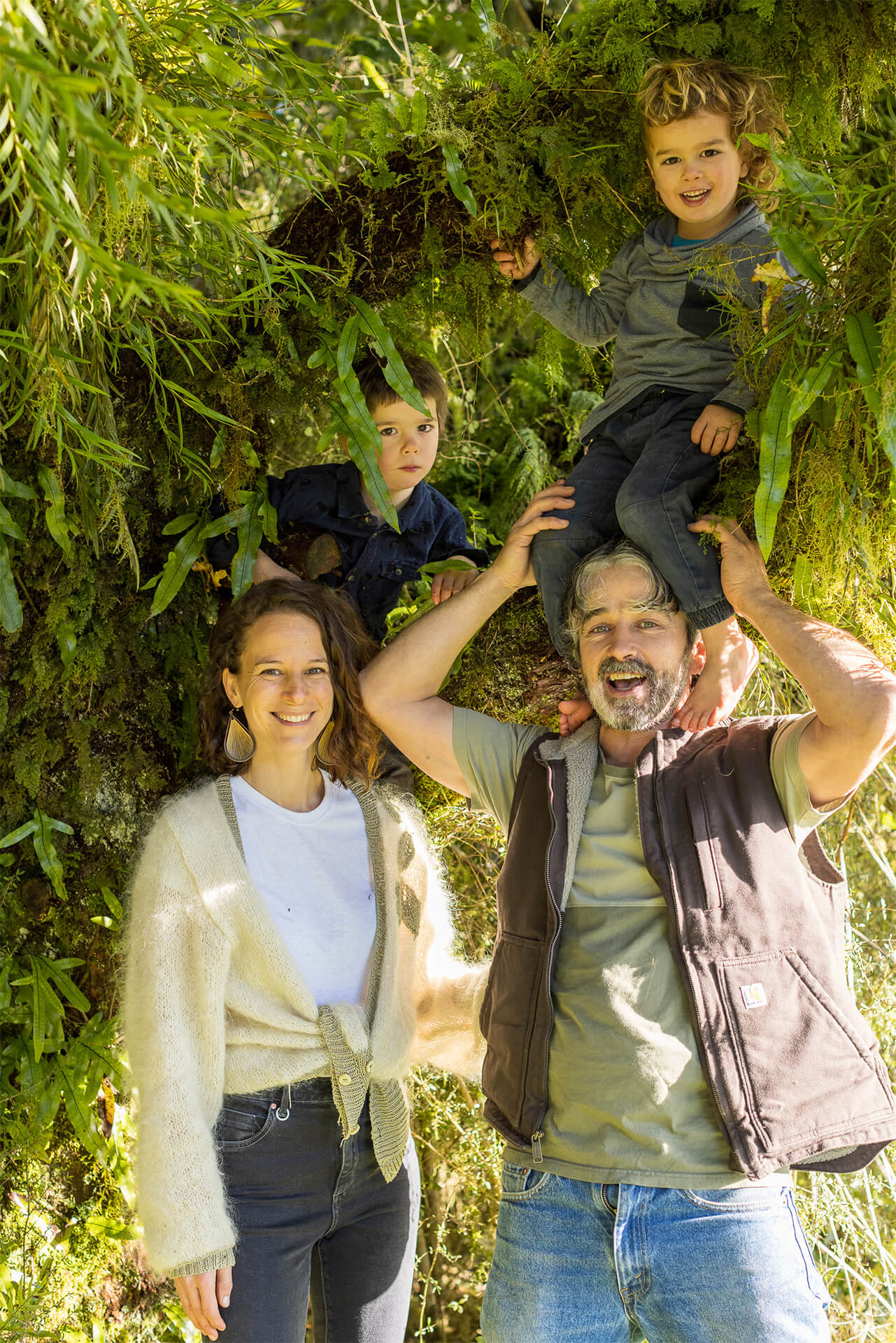 Judith and Danny with children Finley and Rory sitting in tree